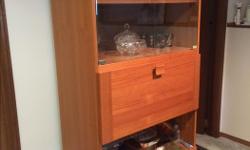 This unique unit acts as a display cabinet and bar unit! This wood and glass piece is in immaculate shape!
32" W
16 1/2" D
73" H
$150 or best offer