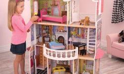 Barbie 3 storey townhouse.House in great condition, including 2 barbies, furniture.