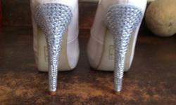 This is a pair of brand new shoes never worn except to try them on when I realized they were too small :( I am in love with these shoes the pictures show their true beauty they are size 6 1/2 color is nude with rhinestone heels and leopard print insole