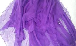 Beautiful purple dress. Zipper on the back. Built in bra. Size:12
Smoke free, pet free home.