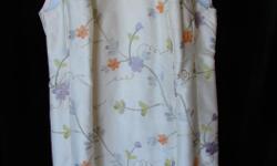 Beautifully tailored hand-made by Jillian Welch. Raw silk with subtle flowers. Beautiful. In great shape. Size 10-12. Can arrange drop-off in Victoria.