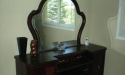 Dark Cherry finished dresser for sale, asking $450.00. Recently moved, dresser doesn't fit new bedroom.