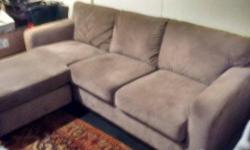 Beige sofa with chaise that can go on either end. 93' wide, chaise extends 60". Good condition.