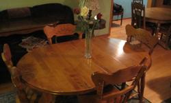 4 chairs plus table and 1 centre leaf. Great condition Solid Birch wood. $500.00 or best offer. email or call 396-3199