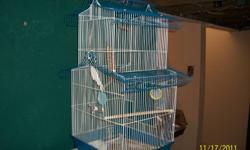 medium  size bird cage blue and white/ seed dish //bird bath good condition 50.00 call Dave 519-800-3587 Kingsville