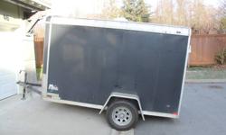 Black 5 X 10 Enclosed cargo trailer
Inside dimmensions 4'9" X 10'4".
Dinged up on the front a bit, has some wood shelves installed.
Could fit one snowmobile (depending on length) or 2 - 3 Dirt bikes.