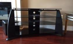 Sleek and stylish Media table for your TV, and electronics.
Very lightly used. New $350-400.
Made of black wood and metal and has 3 shelves plus top in smoke glass
measurements:
Length: 43" glass~46" overall
Width/ Depth: 18"
Height: 26"
