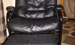 Black leather and metal swivel chair and rocking ottoman for sale. Smoke free, pet free home. In good condition.