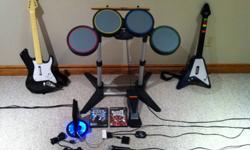 Includes:
- Original black remote with 8 ft. cord
- Light up stand for PS2 Slim
- Microphone
- Drums (with both drumsticks and footpedal)
- Rockband
- Guitar Hero 2
- Two wireless Guitars with straps
- Multitap USB for instruments
 
Excellent condition,
