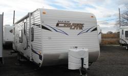 BED WITH A BUNK ABOVE, AN OUTSIDE ACCESS BATHROOM DOOR, A SOFA-KITCHEN SLIDE OUT OPPOSITE THE BOOTH DINETTE AND A WALK AROUND QUEEN BED UP FRONT. 2011 CLEARANCE PRICE $17900. GREAT BUY! FOR ONTARIO'S BEST PRICES AND MORE INFORMATION ON THIS TRAILER AND