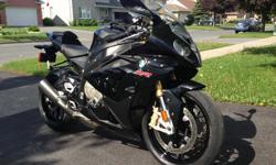 2012 BMW S1000RR is stunning! Black in mint shape. Low mileage 12,425 km. This attractive bike has a 999CC oil cooled 4 cylinder engine creating a superbike with optimized handling and incredible torque. This bike is not only powerful but also extremely