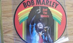 "Bob Marley And The Wailers" 12-Track Picture Disc
I have for sale the "Bob Marley and the Wailers" (made in Denmark) 12-Track
Picture Disc #AR 30004. The disc features in-concert photos of Bob Marley
(on both sides) and includes the following tracks: