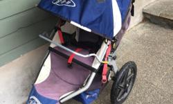 Bob stroller. I clipped my LO's car seat in onto the bar. It also has a cup holder attachment and a rain cover I don't remember ever using. It has the adult cup holder attached. Smoke free pet free home. Cross posted.
