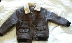 Faux leather/fur bomber jacket. OshKosh brand. Size 3T. New without tags. Pet free and smoke free home.