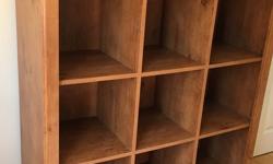 Solid bookcase that looks like real wood but isn't.
Ideal for child's room but can also be used in adult living space.
Dimensions: 44"w X 15 1/4"d X 48"h.
Each cubby is 12 1/2" X 13"h.
Located at DVP & Lawrence