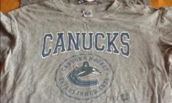Canucks T-shirt Boys Sz. L
Crazy Shirts Boys Sz. L
both in excellent condition from a smoke and pet free home in Langford
