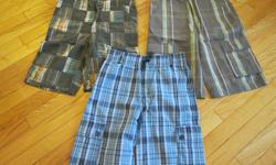 3 pairs of boys Gymboree Size 12 casual shorts.
One is a plaid in gray/orange and turquoise tones.
One is gray with turquoise lines.
One is a blue plaid.
Like new.
