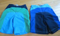 Two pairs of boys size 14 swimming trunks by Landsend. Contrasting design. Like new condition.