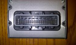 An unused electronic headlight module for any Dodge Grand Caravan.