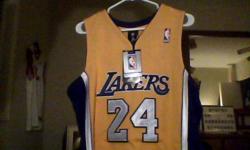 Authentic yellow/purple Kobe Bryant #24 jersey. Medium size. With tags still on jersey because it is 100% brand new. Text or call me if interested - 519 619 7434