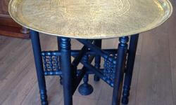 Beautifully detailed heavy brass tray with ebonized folding stand. Tray is 23? in diameter and height on the stand is also 23?. A decorative and functional addition to any room.
ANTIQUE ADDICT
12 Roberts Street, Ladysmith
Open daily 10-5