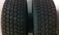 Two 195 65 R14 Bridgestone Blizzak winter tires mounted and balanced on GM 5 bolt rims.  Tires only used for part of one winter and are like new.