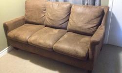 Brown faux leather couch. Removable cushions. Good condition.