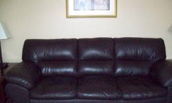 Excellant Condition Chocolate Brown Leather Couch Chair and Ottoman. Rarely used in Livingroom . $600 for all 3 pieces originally cost over $2000 2 years ago.