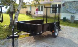 NEW FOR 2012 WE HAVE ADDED A VALUE PRICED 4X6  UTILITY TRAILER FOR THE SMALL CAR OWNER THAT IS BIG ON QUALITY
(1) 2200 LB IDLER AXLE
2X6 WOOD DECK SCREWED DOWN
RAILING AROUND DECK TO SECURE LOAD  , ALSO RAILING IS FILLED IN WITH 18 GAGE STEEL
4 TIE DOWNS