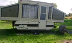 a Bellevue camper asking 1000.00 , sleeps 6 in good condition. It's been totally redone  inside.