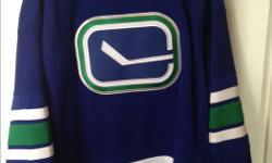 Vancouver canucks sweater. Worn once. like new condition.
Purchased at GM place.