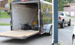For sale, 14` Cargo Mate enclosed R.V. / Utility Trailer. Custom Racking/shelving . Good condition. Try your offer. 250-613-1193
