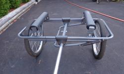 Cart easily attaches to bicycle's rear hub. Detach with quick-release levers. Straps are included.
Cart frame is light weight anodized aluminum and stainless steel hardware. Rugged inflatable tires. Cart wt. 20 lbs.
Can handle items up to 15 ft. long /