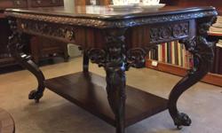 Amazing carved angels and paw feet on the legs of this ribbon mahogany library table that has a drawer on either side. This stunning table has been completely restored and will define and elevate any space! 54? long, 32? wide, 31? high
ANTIQUE ADDICT
12