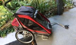 This stroller is an excellent investment for a growing family. Canadian-made and durable, this double wide, aluminium frame stroller is great as a stroller or to pull behind a bike. Purchased in 2007, this Chariot Cougar 2 has been well used, but still