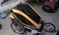 Comes with
Stroller Kit
Jogging Kit
Bicycle Kit
Infant Sling
This is the info provided by the Chariot website:
Cougar 2 Features
2-in-1 weather cover with Quickclip?, for easy and silent access to the child compartment, and Tough-Tek reinforcement fabric
