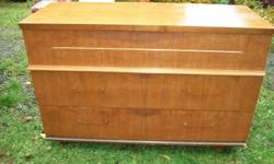 cherry wood dresser with 3 double drawers .  Each drawer is the full width of the dresser and is divided into 2 drawers on the inside.  33 inch high by 47 long  by 18 deep  call 604 858 6955