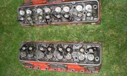 2.02 heads with valves, valve springs, and rocker arms. Camel hump stamp. Call 403-512-4718.