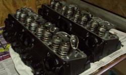 Have a set of 1982 305 ci. heads. Casting # 14014416.  Cleaned, decks planed,  valves ground,  seats ground,  painted black and assembled with new seals.  also comes with rockers.  every thing is stock spec.  will partialy dis-assemble to prove.  these