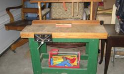 This is a real miniature child's workbench with working vice, slot for tools - includes some child sized real tools. Just like daddy's!!