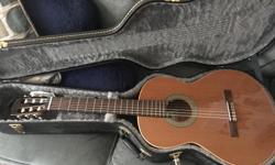 Almansa Spanish Guitar. It is handmade and comes with the case and a tuner.