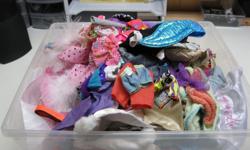 Container full of Barbie Clothes 15 x 14 x 7 inches container