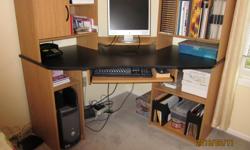 Corner Computer Desk by Ridgewood/Charleswood. Pull out keyboard tray, large work surface, lots of storage. Desk was partly disassembled to move but is too big for my small apartment. Asking $35.00 but open of offers. Must sell.
