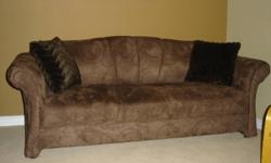 Couch and love seat less than one year old.   Brown suede