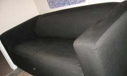 Reduced price! This couch sells for new for $300.00 from Ikea. It is a loveseat couch and is in great condition.  It is easy to keep clean with a removable, machine washable black cover. The couch has a low back and a modern look.  There is a small tear