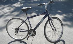 21 speed leisure bike for a man or woman, this bike is called C.C.M excelsior 700 hybrid, it has an 18 inch frame, 700 alloy rims, rapid fire shifters your handle bars & neck adjust for a comfortable ride, front wheel is quick release with a deep rim,