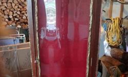 Beautiful dark wood curio cabinet with gold scroll work. Red interior with three glass shelves
Contact Heather at 688-1881