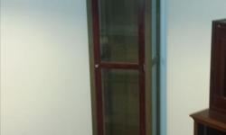 Curio Cabinet in solid wood with glass shelves. In excellent conditon.