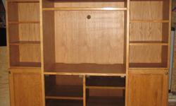 SOLID OAK FACING,TRIM, AND RAISED PANEL DOORS , PLYWOOD VENEER PANELS AND SHELVES. SMOKE GLASS DOORS, TWO FULL EXTENSION DRAWERS, HIDDEN INNER CD,DVD SHELVES.
THREE SEPARATE UNITS; TOTAL OVERALL IS 80" WIDE X 88" HIGH.
MIDDLE UNIT IS 24.5 " DEEP X 39"
