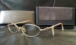 Authentic David Yurman woman's metal, oval modified, shiny gold buckle eyeglass frames with clear lenses, model DY009, measuring 53*15*135 and originally priced at $695 (has original tag), with DY hard case and lens cloth, $195 obo